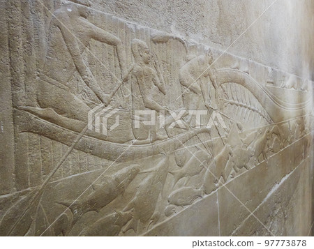 old egypt hieroglyphs carved on the stone 97773878