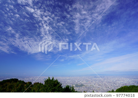 Great panorama of Osaka seen from the observatory with the ringing bells on an autumn morning 97774018