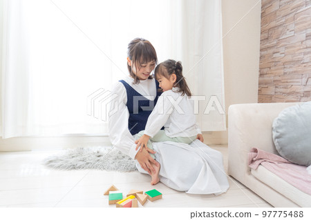 Mother playing holding a girl 97775488