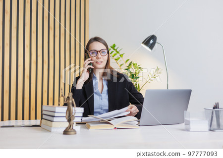 female lawyer in strict suit works in office or court, checks clients' contracts. Caucasian successful business lady 97777093