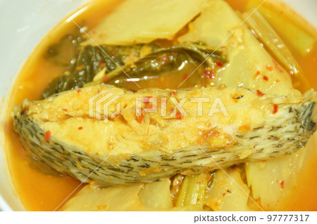spicy boiled snakehead fish and mixed vegetable in spicy soup on bowl  97777317