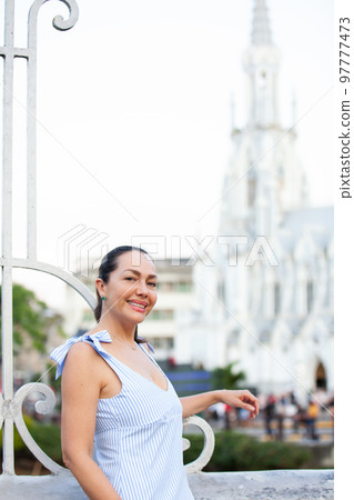 Beautiful tourist woman at the Ortiz Bridge with La Ermita church on background in the city of Cali in Colombia Beautiful tourist woman at the Ortiz Bridge with La Ermita church on background in the city of Cali in Colombia 97777473
