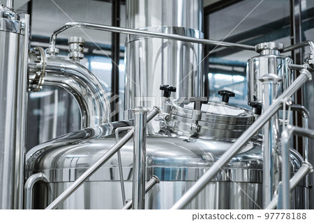 Close-up of big stainless tank for brewing beer in bottling plant 97778188