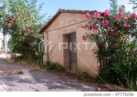 A quiet street of residential buildings in the historic medieval village of Panzano Tuscany 97778286
