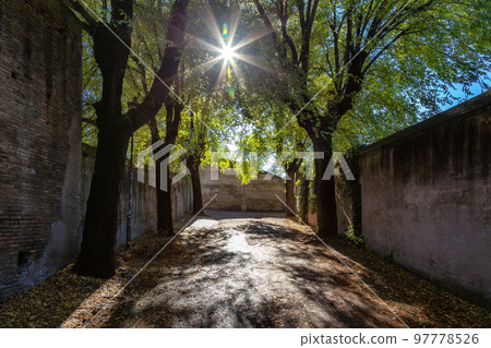 Pathway in City Park. Brick Old Historic Walls. Rome, Italy. Pathway in City Park. Brick Old Historic Walls. Rome, Italy. 97778526