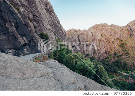 dangerous highways serpentine through the rocky mountains of Norway. 97780336