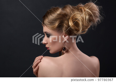 Close-up portrait, girl in vintage, shabby chic, retro style and white dresses on a black background Close-up portrait, girl in vintage, shabby chic, retro style and white dresses on a black background 97780367