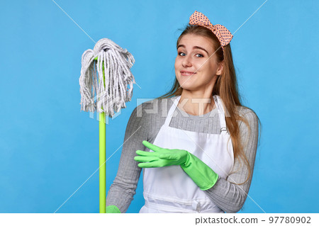 woman in rubber gloves and cleaner apron holding mop woman in rubber gloves and cleaner apron holding mop 97780902