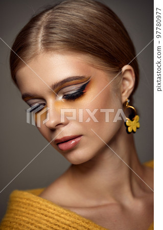 Beauty blonde model girl with fashionable creative make-up 97780977