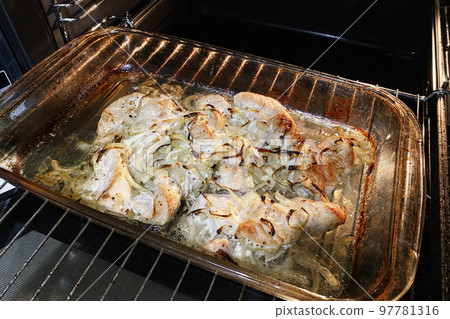 Chicken breast is fried, cooking process. Process of cooking spicy chicken meat in oven. Close up. Chicken breast is fried, cooking process. Process of cooking spicy chicken meat in oven. Close up. 97781316