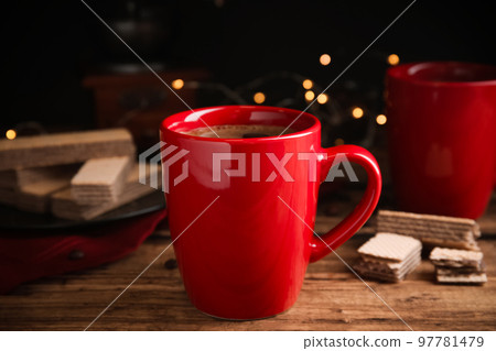 Delicious coffee and wafers on wooden table 97781479