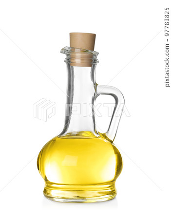 Cooking oil in glass jug isolated on white Cooking oil in glass jug isolated on white 97781825