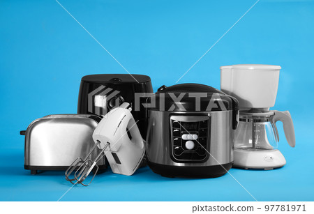 Set of different household appliances on light blue background 97781971
