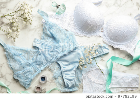 Flat lay composition with women's underwear on marble background Flat lay composition with women's underwear on marble background 97782199
