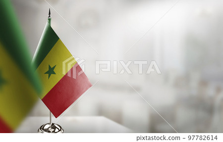 Small flags of the Senegal on an abstract blurry background 97782614