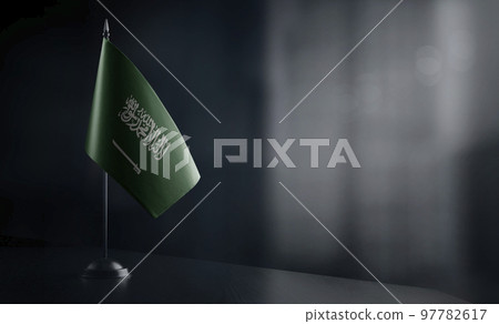 Small national flag of the Saudi Arabia on a black background Small national flag of the Saudi Arabia on a black background 97782617