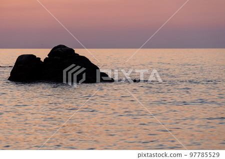 Tropical colourful sunrise landscape. Nature landscape. Tropical island coast. Beautiful view of orange sunset seascape with rocks 97785529