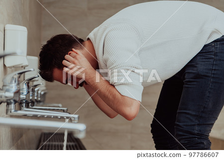 A Muslim performing ablution. Ritual religious cleansing of Muslims before performing prayer. The process of cleansing the body before prayer 97786607