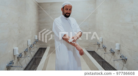 A portrait of a man in abdesthana using a towel 97786608