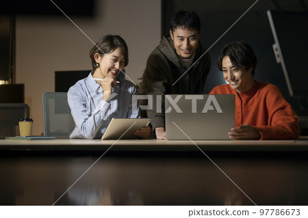 Casual business image Office at night Casual business image Office at night 97786673