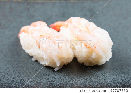 Two rolls of delicious sweet shrimp nigiri sushi 97787780