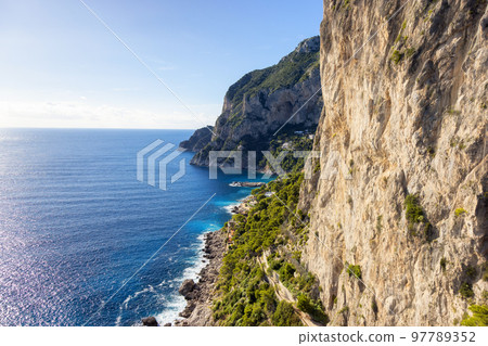 Rocky Coast by Sea at Touristic Town on Capri Island in Bay of Naples, Italy 97789352