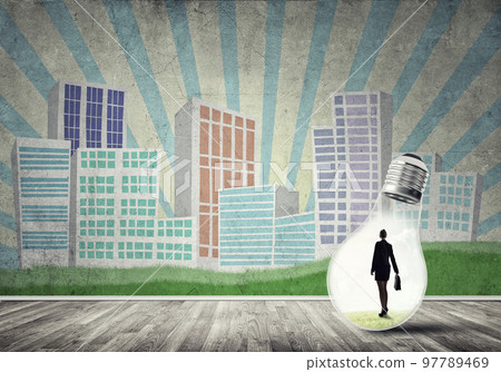 Businesswoman trapped in bulb Businesswoman trapped in bulb 97789469