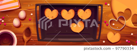 Baking sheet with cookies on kitchen table 97790334
