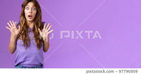 Ambushed shocked girl gasping not expect friend jump out corner raise palms surprised astonished drop jaw open mouth stunned stare camera impressed stupefied purple background Ambushed shocked girl gasping not expect friend jump out corner raise palms surprised astonished drop jaw open mouth stunned stare camera impressed stupefied purple background 97790809