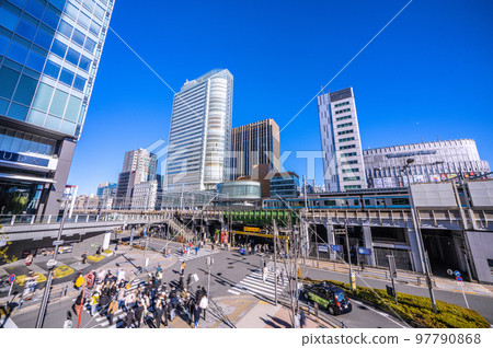 The cityscape of Tokyo, Japan, overlooking office buildings in front of Akihabara Station 97790868