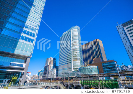 Cityscape of Tokyo, Japan View of office buildings in front of Akihabara Station (black Yamanote Line in the background) 97791789