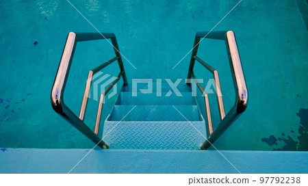 A shot of the pool railing from directly above A shot of the pool railing from directly above 97792238
