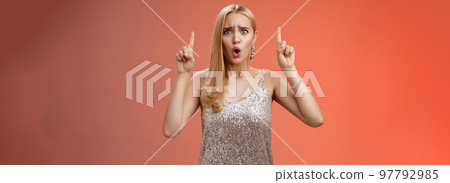 Upset gloomy complaining blond whining girl in silver stylish luxurious dress frowning cringing unhappy pointing up regret jealous tell boyfriend sale over, standing depressed sad red background Upset gloomy complaining blond whining girl in silver stylish luxurious dress frowning cringing unhappy pointing up regret jealous tell boyfriend sale over, standing depressed sad red background 97792985
