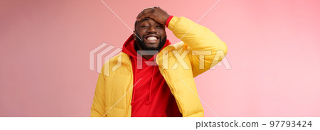 Charming cute black bearded 25s guy forget something stupid silly smiling friendly punch forehead grinning feel awkward say sorry standing pink background joyfully relaxed 97793424