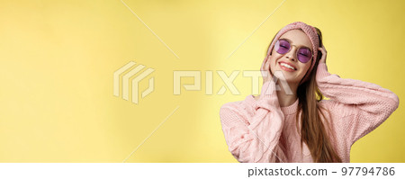 Waist-up shot of lovely glamour carefree young woman ready for vacation, packing bags move out of winter, travelling, smiling joyfully close eyes happily, touching face, wearing sunglasses sweater Waist-up shot of lovely glamour carefree young woman ready for vacation, packing bags move out of winter, travelling, smiling joyfully close eyes happily, touching face, wearing sunglasses sweater 97794786