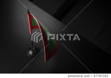 Small national flag of the Maldives on a black background 97795385