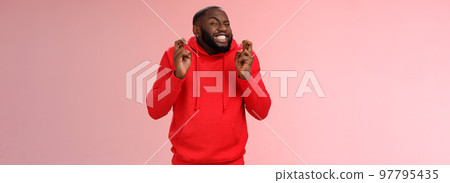 Guy hope luck cross fingers making wish hold breath excited close eyes ready meet fortune anticipating positive news thrilled playing lottery hopefully praying dream come true, pink background 97795435