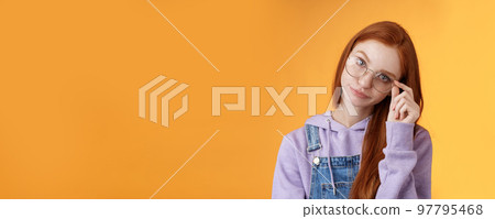 Annoyed bossy unimpressed bothered young redhead female coworker smirking tilting head irritated touch glasses look ignorant cringing stupid uninteresting doubtful story not buy any excuses Annoyed bossy unimpressed bothered young redhead female coworker smirking tilting head irritated touch glasses look ignorant cringing stupid uninteresting doubtful story not buy any excuses 97795468