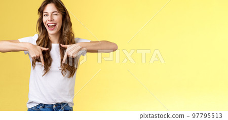 Hey visit my link would not regret. Lively cheeky enthusiastic woman curly long haircut wink sassy smiling broadly show you perfect copy space pointing down bottom promo yellow background Hey visit my link would not regret. Lively cheeky enthusiastic woman curly long haircut wink sassy smiling broadly show you perfect copy space pointing down bottom promo yellow background 97795513