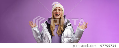 Joyful happy blond woman free emotions yelling happily having fun enjoying awesome astonishing day smiling broadly raising hands up triumphing celebrating win achivement dream come true Joyful happy blond woman free emotions yelling happily having fun enjoying awesome astonishing day smiling broadly raising hands up triumphing celebrating win achivement dream come true 97795734