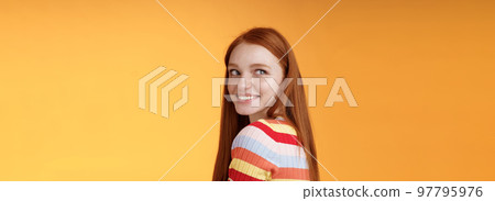 Tender romantic carefree european redhead girlfriend turning behind look left amused smiling pleased coquettish gaze standing orange background flirty romantic mood wanna receive date invitation Tender romantic carefree european redhead girlfriend turning behind look left amused smiling pleased coquettish gaze standing orange background flirty romantic mood wanna receive date invitation 97795976