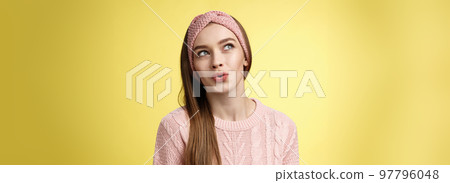 Cute pretty silly girl sharing dreams and fantazies, daydreaming, thinking about desires, speaking about what she wants, daydreaming looking at upper left corner thoughtful, folding lips amused Cute pretty silly girl sharing dreams and fantazies, daydreaming, thinking about desires, speaking about what she wants, daydreaming looking at upper left corner thoughtful, folding lips amused 97796048