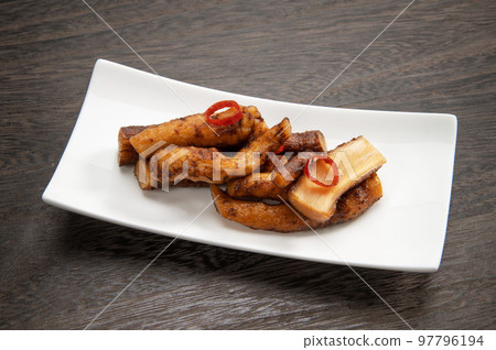 Edible wild burdock marinated in soy sauce 97796194