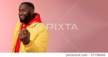 Cheeky flirty black bearded guy asking come closer beckon index finger camera smiling make smug face have plans for you alluring join, standing pink background devious grin 97796660