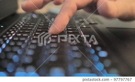 Finger pressing an enter key. Computer user hitting the enter key, up close. Confirmation, sending a message Finger pressing an enter key. Computer user hitting the enter key, up close. Confirmation, sending a message 97797767