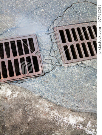 Drain grates on the road. Drain grates on the road. 97798593