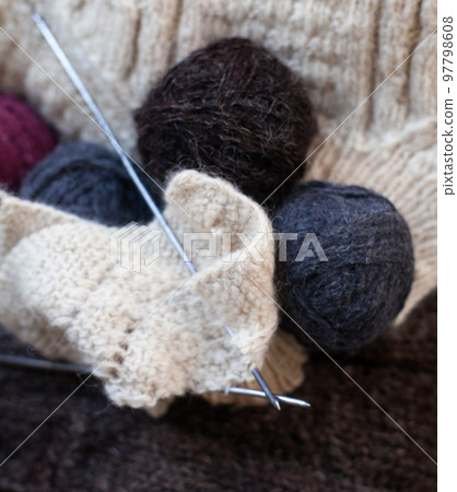 Knitting. Knitting needles with the balls of wool 97798608