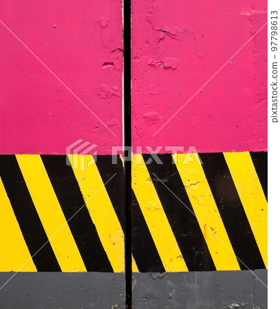 Concrete columns with safety stripes. 97798613