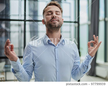 Young worker having break and resting after solving task Young worker having break and resting after solving task 97799939