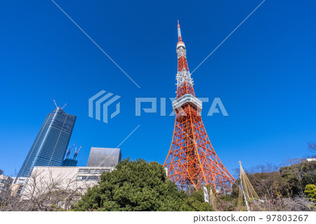Tokyo cityscape in Japan Looking at Tokyo Tower and Toranomon / Azabudai project shining in the blue sky = December 29 97803267